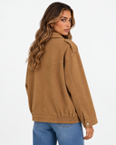 Khaki Avery jacket on a model, with long sleeves and a textured finish.
