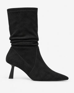 Celestine black boots, side view showing the gathered shaft and slender heel.