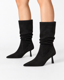 Celestine black boots, worn view showing the boot shafts.