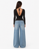 Back view of the Esme black top showing the low draped back and neck tie