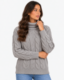 Harriet Grey cable-knit roll-neck jumper, three-quarter close-up of the roll neck and ribbed cuffs