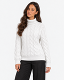 Harriet White cable-knit roll-neck jumper, front portrait showing the cable-knit pattern and ribbed hem
