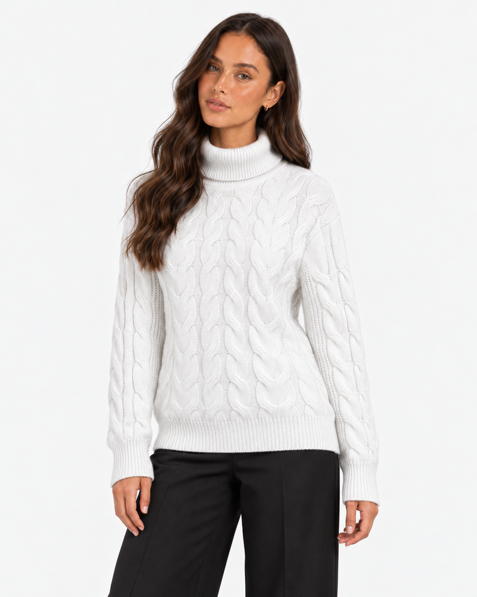 Harriet White cable-knit roll-neck jumper, front portrait showing the cable-knit pattern and ribbed hem