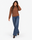 Harriet Light Brown cable-knit roll-neck jumper, full-length front styling with dark blue jeans