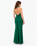 Woman wearing the Isolde dark green halter maxi dress, full-length back view