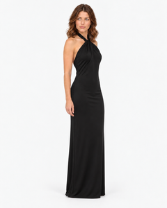 Woman wearing the Isolde black halter maxi dress, full-length front view