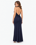 Woman wearing the Isolde dark blue halter maxi dress, full-length back view
