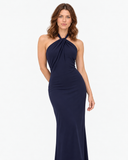 Woman wearing the Isolde dark blue halter maxi dress, full-length front view