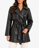 Close-up of Maren black faux leather trench coat showing wide lapels and tied waist belt
