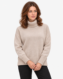 Naomi khaki roll-neck jumper, full-length front pose