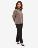 Naomi brown roll-neck jumper, three-quarter full-length view