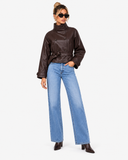 Three-quarter standing view of Veda dark brown belted faux leather jacket