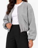 Aveline Gray zip-up baseball jacket, close-up of open front and sleeve