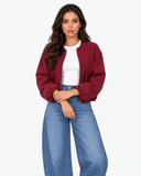 Aveline Wine Red zip-up baseball jacket, front pose with hands together