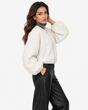 Aveline Beige zip-up baseball jacket, three-quarter pose