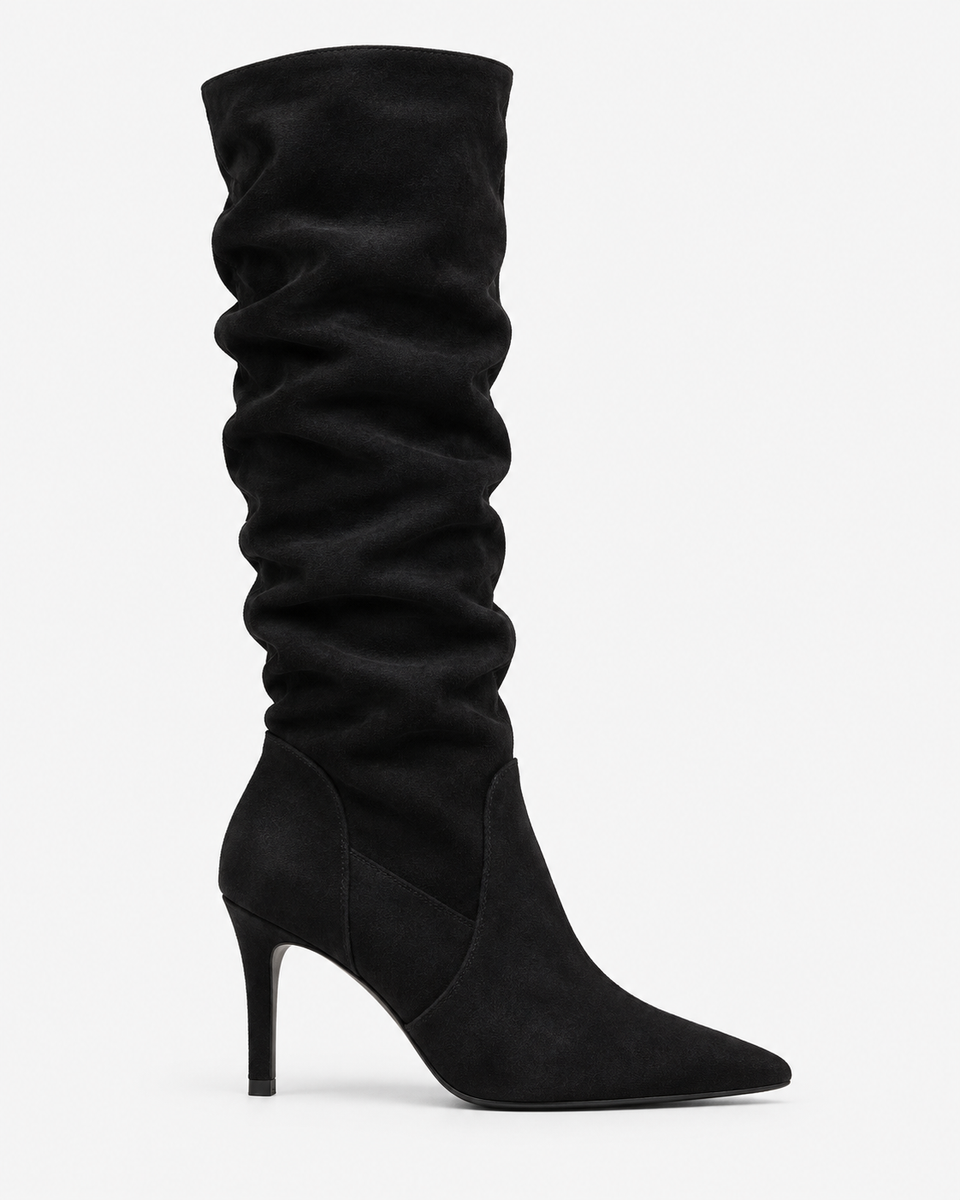Ines black boots, side view showing the pointed toe and stiletto heel.