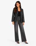 Mariette black leather-effect blazer with dark grey wide-leg jeans, full-length three-quarter view