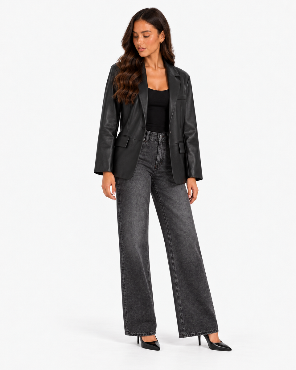 Mariette black leather-effect blazer with dark grey wide-leg jeans, full-length three-quarter view