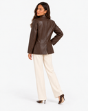 Mariette brown leather-effect blazer from the back with cream trousers