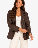 Mariette brown blazer in an upper-body three-quarter pose with cream separates