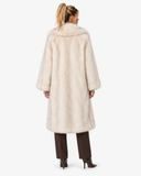 Back view of the Claudine cream longline faux-fur coat on a model.
