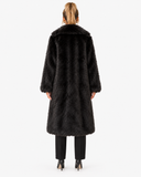 Back view of the Claudine black longline faux-fur coat on a model.