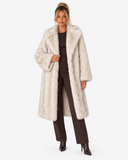Full-length front view of the Claudine cream longline faux-fur coat worn open.