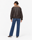 Elowen brown faux leather jacket, back view showing the collar and gathered hem