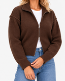 Estelle High Neck Zip Cardigan in brown – close-up of the two-way zip and ribbed cuffs