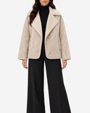 Front view of the ivory Eveline teddy-lined suede-look jacket showing its wide collar, button fastening and side pockets