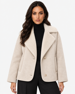 Model wearing the ivory Eveline teddy-lined suede-look jacket open over a black roll-neck top