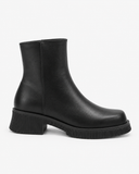 Alba black boots, side view showing the rounded front and ribbed sole edge.