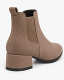 Livia camel boots, rear three-quarter view of the heel and elasticated panel.