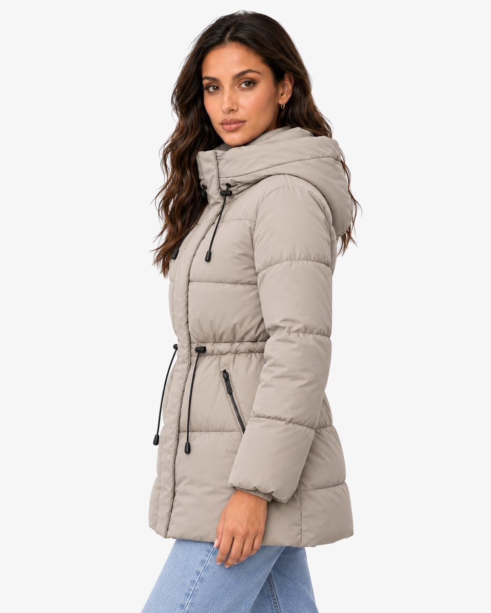 Side view of the Iselle khaki hooded puffer coat with light denim
