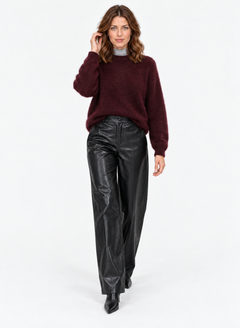 Wine-red round-neck knit sweater shown in a standing pose with black trousers.