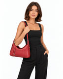 Maya wearing Cercii Nola Black top and carrying Mara Wine Red bag