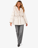 Full-length view of the white Nerina faux fur-collar coat styled with grey jeans and boots