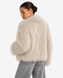 Noeline Beige Apricot faux-fur jacket shown from the back in a three-quarter pose