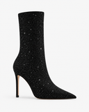 Ophelia black boots, side view showing the pointed toe and stiletto heel.
