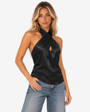 Model wearing the Roselle black satin halter top