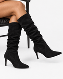 Ines black boots, worn view showing the tall gathered shafts.