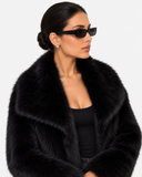 Close-up side view of the Solenne black faux-fur jacket collar and texture