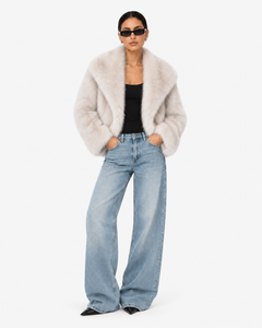 Front view of the Solenne ivory faux-fur jacket with wide collar and long sleeves