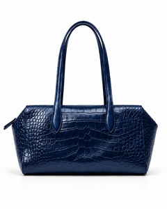 Front view of a dark blue crocodile-pattern tote bag with twin handles against a white background.