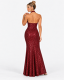 Back view of the Virelle wine red sequin maxi dress showing the open back and flared hem.