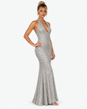 Three-quarter view of the Virelle silver sequin halter maxi dress with a hand-on-hip pose.