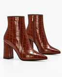Violetta brown boots, pair viewed at an angle with the side zip visible.